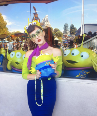 woman dressed as green alien from toy story