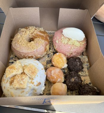 open box of doughnuts and donut holes