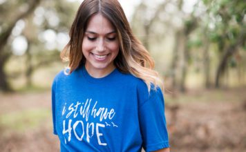 woman wearing infant loss tshirt that says I still have hope