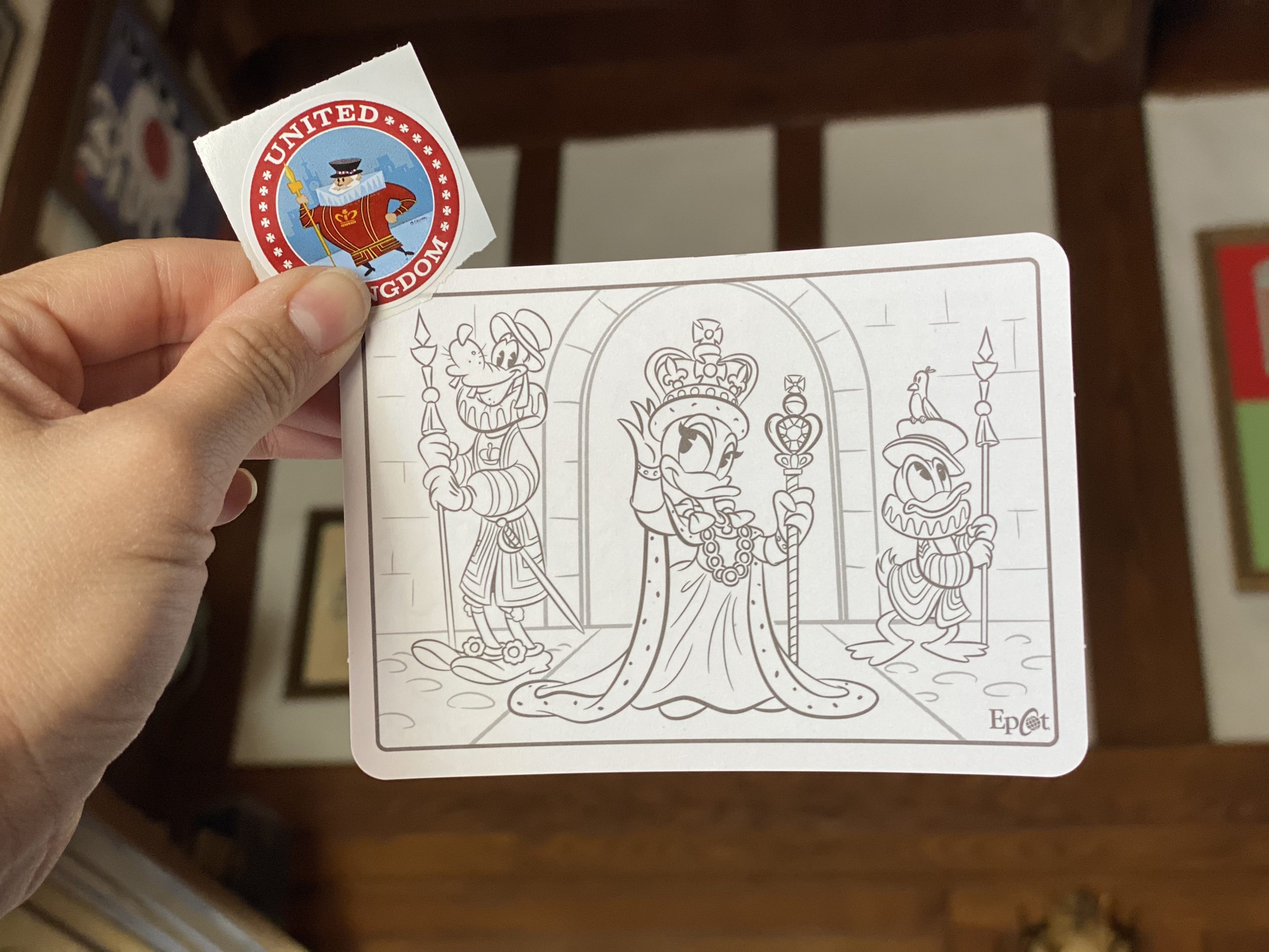 Queen Daisy with Goofy and Donald behind her on the England Kidcot card and a sticker