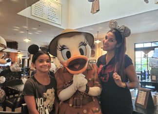 Mom and daughter with Daisy Duck at Disney's Animal Kingdom restaurant Tusker House