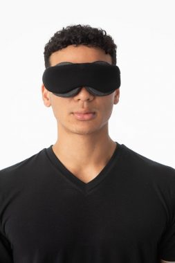 man wearing a sleep eye mask