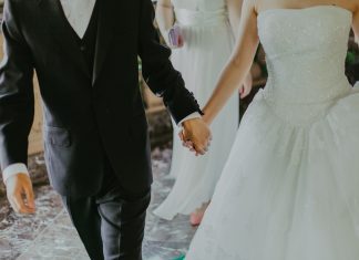 couple on wedding day holding hands