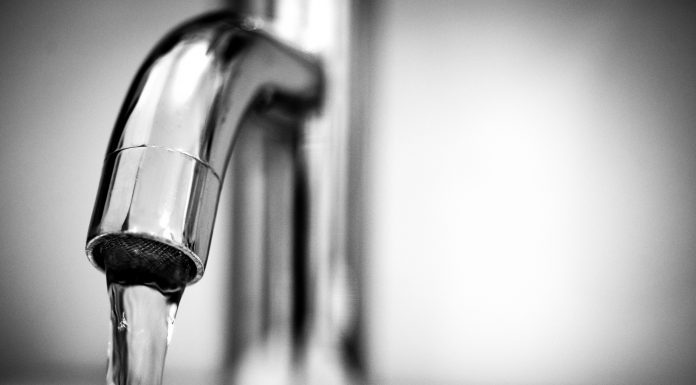 ttps://www.pexels.com/photo/macro-photography-of-a-stainless-steel-faucet-615326/ Alt text: A tap with water flowing from it