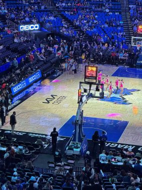 zoomed in on the court at the Kia Center with halftime show happening