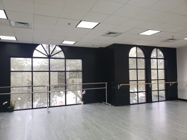 Dance studio windows with a beautiful view of trees outside