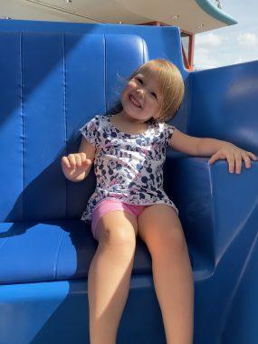 Little girl on blue chair of the PeopleMover