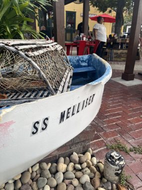 boat in front of restaurant reads "SS Melliser", date night in St. Augustine