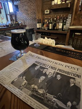 newspaper with a pint of beer, newspaper reads "Roosevelt ends Prohibition", date night in St. Augustine