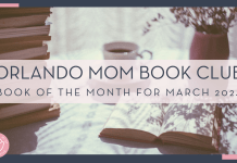 Freestocks via unsplace image of stack of books, coffee mug, open book, and flowers in a vase on a table with words 'Orlando Mom book club book of the month for march 2024' over top