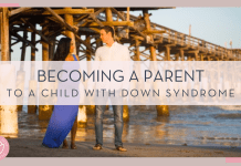 a pregnant mom in blue dress with man in jeans and white shirt next to her in front of a wooden bridge and water with 'becoming a parent to a child with Down syndrome' in text on top of photo