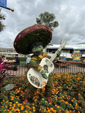 Miguel, from the movie Coco, made from plants with a guitar in his hands.
