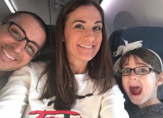 man, woman, and child smiling at camera on a plane. alternative birthday party