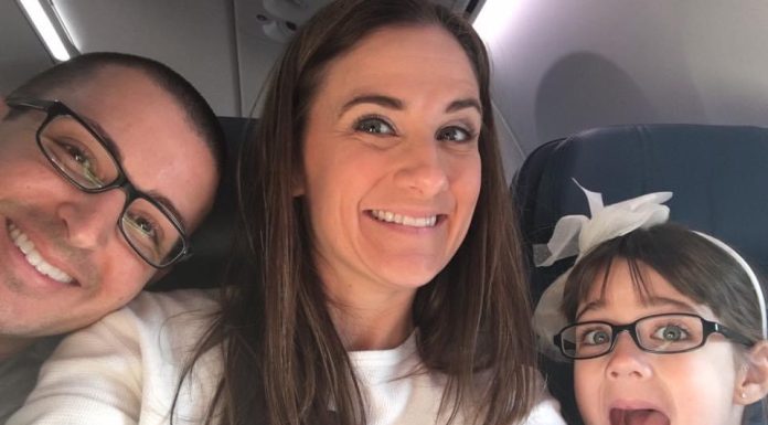man, woman, and child smiling at camera on a plane. alternative birthday party