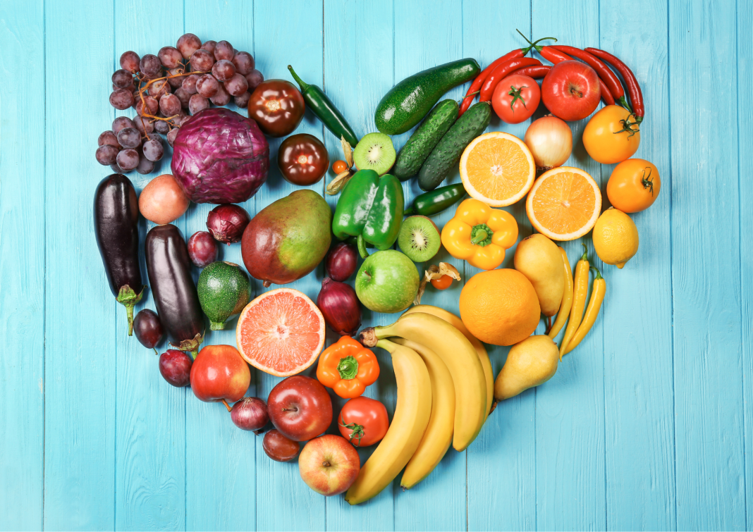 Fruits and vegetables organized by color in shape of a heart