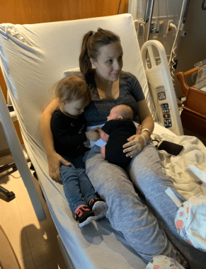 mom on hospital bed with baby and toddler
