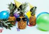 Pineapples whereing sunglasses with balloons for summer party ideas
